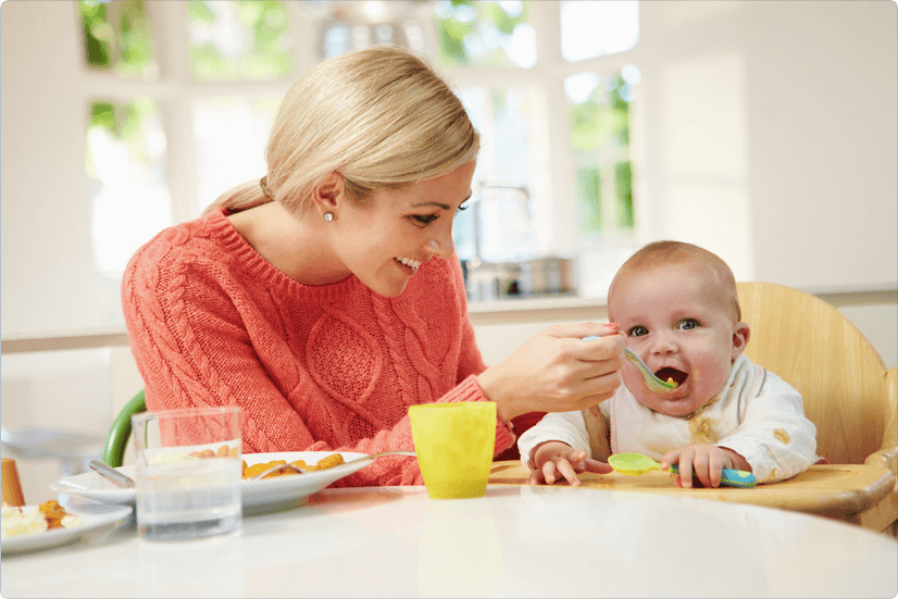 Screenshot 2024-07-31 at 16-33-28 Mother Feeding Baby Sitting in High Chair – zdjęcia od platformy Canva